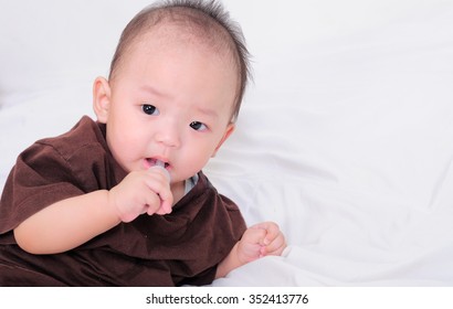 Baby Taking Medicine With Dropper