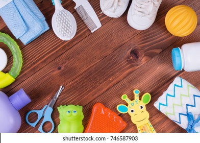 Baby Things On The Wooden Background