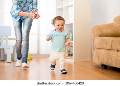 Baby Toddler Have A Fun Running In Living Room With His Mother