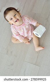 Baby With Toilet Paper. Top View Of Smiling Baby