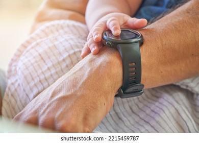 Baby Touching Her Father Smart Watch Device