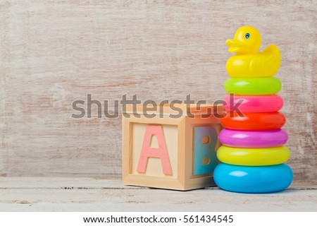 Baby toys on wooden table. Child development concept