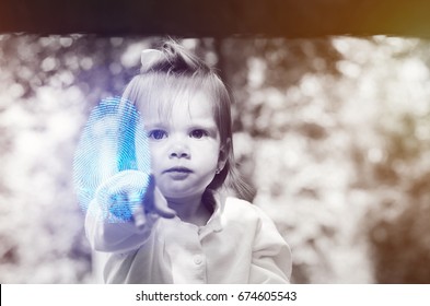baby two years pointing a fingerprint at the camera, digital and copy space
