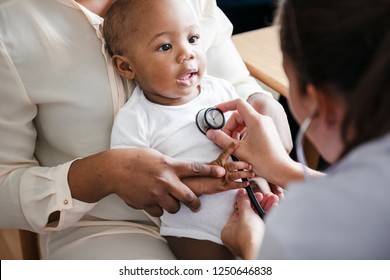 Baby visit to the doctor - Shutterstock ID 1250646838