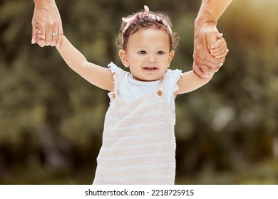 Baby, Walking And Learning With Holding Hands With Parents In Garden, Help And Girl. Child, Walk And Teaching To Balance, Coordination Or Motor Skills For Steps With Support, Care Or Love In Backyard