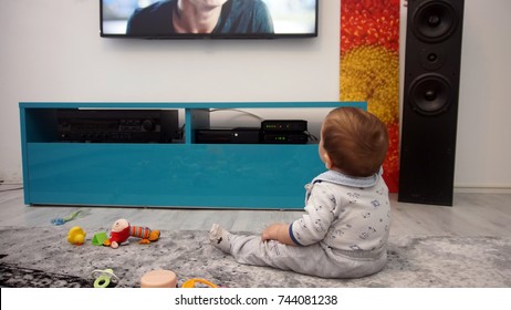 Baby Watching TV Sitting On The Floor