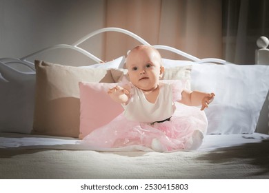 Baby wearing a pink tutu crawls on a bed with soft pillows in a warm, indoor setting during daylight - Powered by Shutterstock