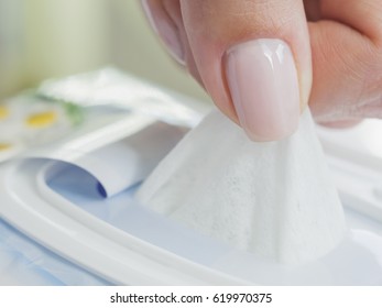 Baby wet wipes in a woman's hand. 