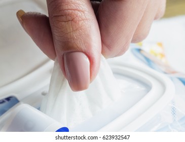 Baby Wet Wipes In A Woman's Hand.