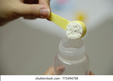 Baby White And Cream Milk Powder Pour In Milk Bottle By Mom Hand Prepare For Baby Milk Drinking Meal With Love And Care