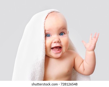 Baby White Towel On Grey Background.