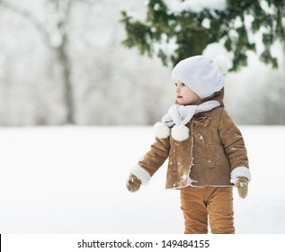 Baby In Winter Park Looking On Copy Space