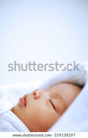 Similar – Newborn baby girl sleeping on blue sheets at home