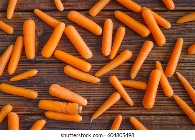 Baby-Cut Carrots On Wood. Top Down View.