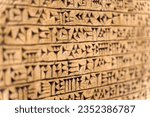 Babylonian historical writing selected focus background. Ancient hieroglyphs of the Sumerian and Babylonian civilizations. Archaeological objects and antiquities