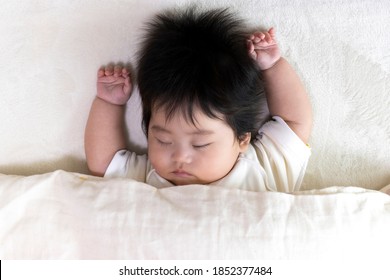 Baby's Face Sleeping On A Futon, 0 Years Old, 4 Months Old, Girl