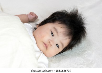 Baby's Face Wearing A Futon, 0 Years Old, 4 Months Old, Girl