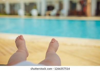 Baby's Feet Near Swimming Pool 