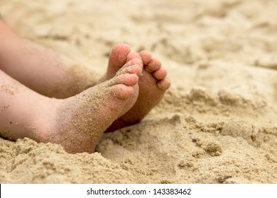 Baby's Feet In The Sand