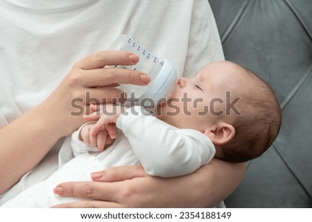 Similar – Baby taking feeding bottle