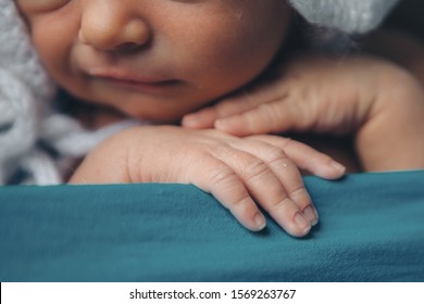 Baby's hand, fingers close up. newborn baby arms, massage concept of childhood, health care, IVF, hygiene