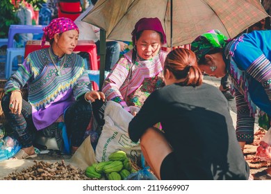 Bac ha, Vietnam - July 7, 2019 : Hmong women selling vetgetable in Bac Ha market, Northern Vietnam. Bac Ha is hill tribe market where people come to trade for goods in traditional costumes