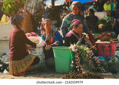 Bac ha, Vietnam - July 7, 2019 : Hmong women selling vetgetable in Bac Ha market, Northern Vietnam. Bac Ha is hill tribe market where people come to trade for goods in traditional costumes