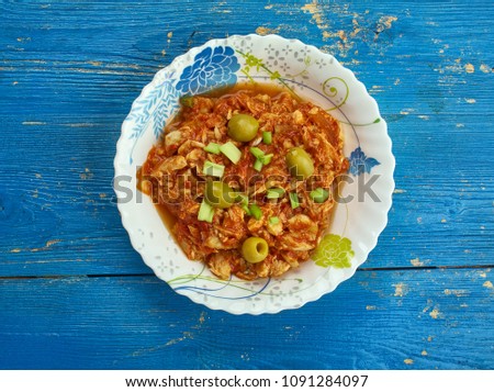 Bacalao a la Vizcaíba - Salt cod appears on Christmas Eve tables throughout Mexico, version of salt cod with almonds and olives comes