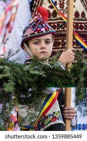 Bacau, Romania - December 27, 2019: A little boy  dressed in romanian traditional costume  during "New Year's Day Romanian Tradition Festival".