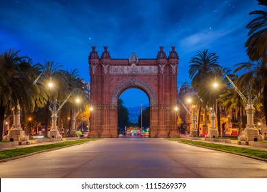 Bacelona Arc De Triomf At Night In The City Of Barcelona In Catalonia, Spain. The Arch Is Built In Reddish Brickwork In The Neo Mudejar Style