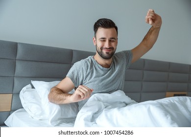 Bachelor man daily routine single lifestyle morning concept awakening gymnastic