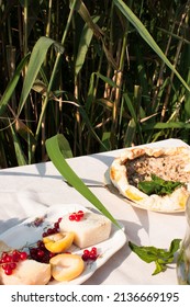 Bachelorette Party Event In Nature With A Cake Near The Lake 