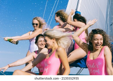 Bachelorette party on a yacht. Hen-party. Beautiful girls in a bathing suit. Bride and bridesmaids.