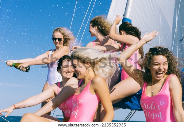 Bachelorette party on a yacht.\
Hen-party. Beautiful girls in a bathing suit. Bride and\
bridesmaids.