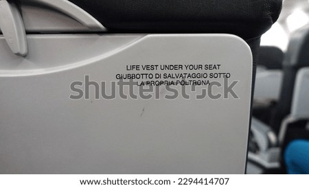 Similar – Image, Stock Photo don’t inflate your vest while inside the aircraft