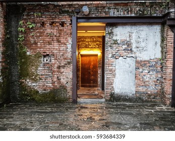 Back Alley Door Of The House With Old Brick Wall Texture