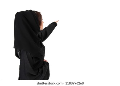 Back Arab Of Young Woman Pointing At Something. Isolated On White Background