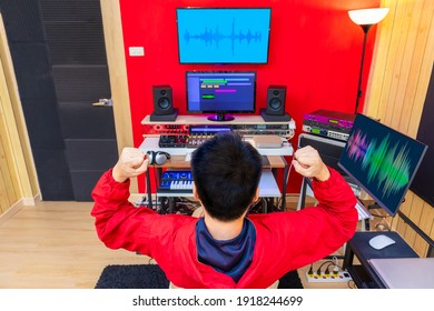 Back Of Asian Music Producer Feel Happy When Finished His Work In Recording Studio