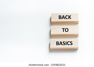 back to basics text on wooden blocks that lie on a white background