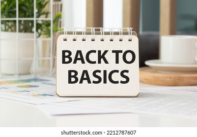 BACK TO BASICS two notepads with text on a white background next to a calculator and a potted plant