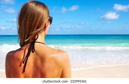 Back Of Beautiful Girl In Bikini  On Tropical Beach