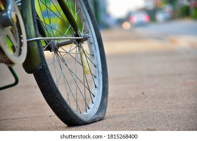 Back Bike Wheel Is Broken And Flat. (Selective Focus At The Wheel)