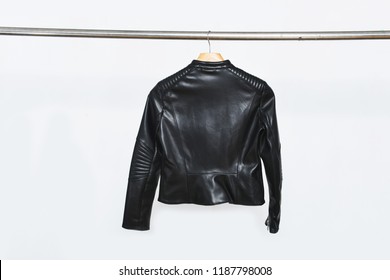 Back Of Black Leather Jacket On Hanger 
