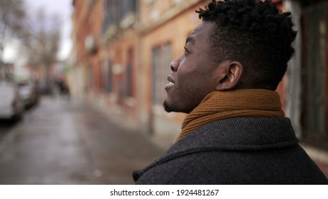 Back Of Black Walking Outside In City. African Person Perspective In European Town