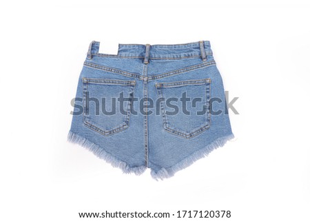 Back of blue jean shorts isolated background flat lay summer fashion. Pockets shown on this pair of denim shorts.


