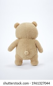 The Back Of A Brown Teddy Bear With A White Background