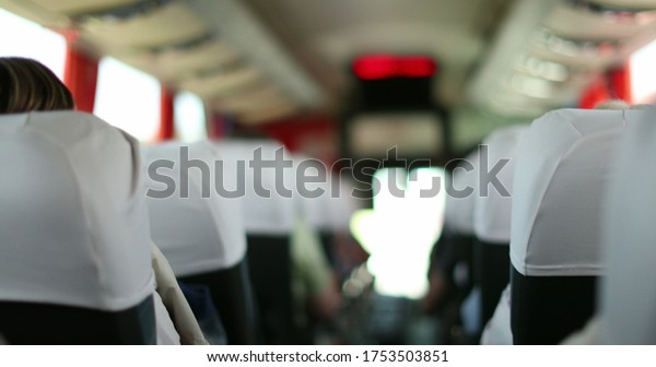 \
Back of a bus perspective. Passenger POV\
traveling by bus in\
Europe