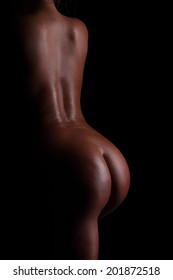 Back And Butt Naked Women.on A Black Background