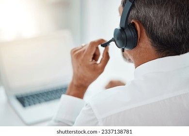 Back, call center and man listening for customer service, support and business with laptop. Contact us, telemarketing microphone and professional, sales agent and crm consultant working at help desk - Powered by Shutterstock