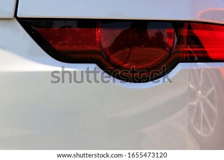 Back car Lights close up. White sports car closeup. Jaguar F-type